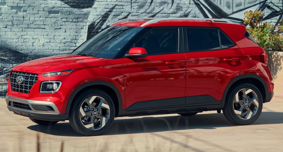 A red 2022 Hyundai Venue subcompact SUV is parked. 