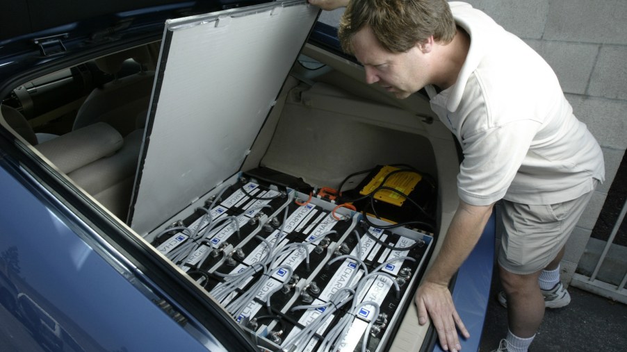 Man shows the aftermarket lithium-ion battery pack he installed in his NiMH Prius to upgrade its range and power.