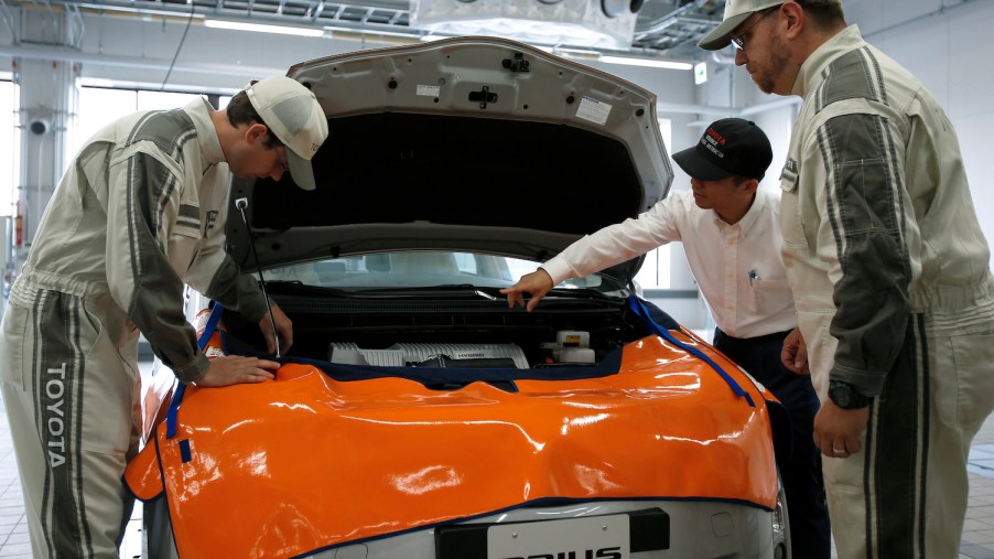 Toyota dealership technicians in training learn how to replace a Prius hybrid high-voltage battery.