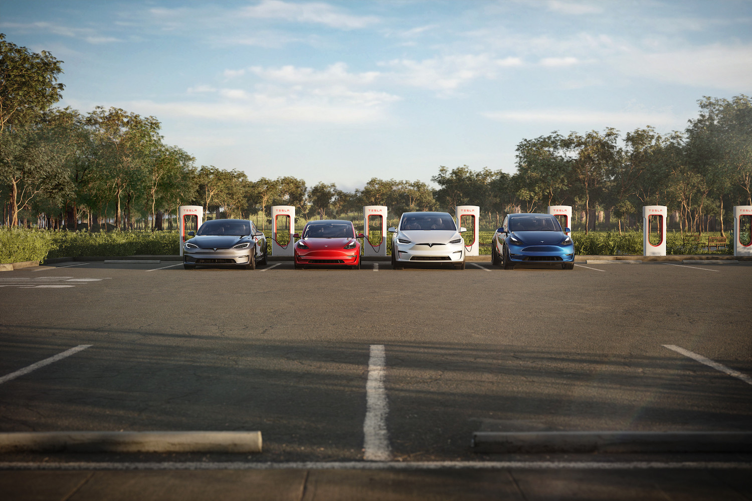 A row of used Tesla electric vehicles all plugged into Supercharger stations, trees visible in the background.