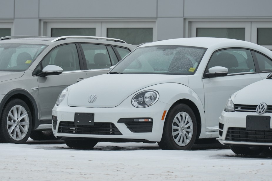 A used Volkswagen Beetle in the snow.