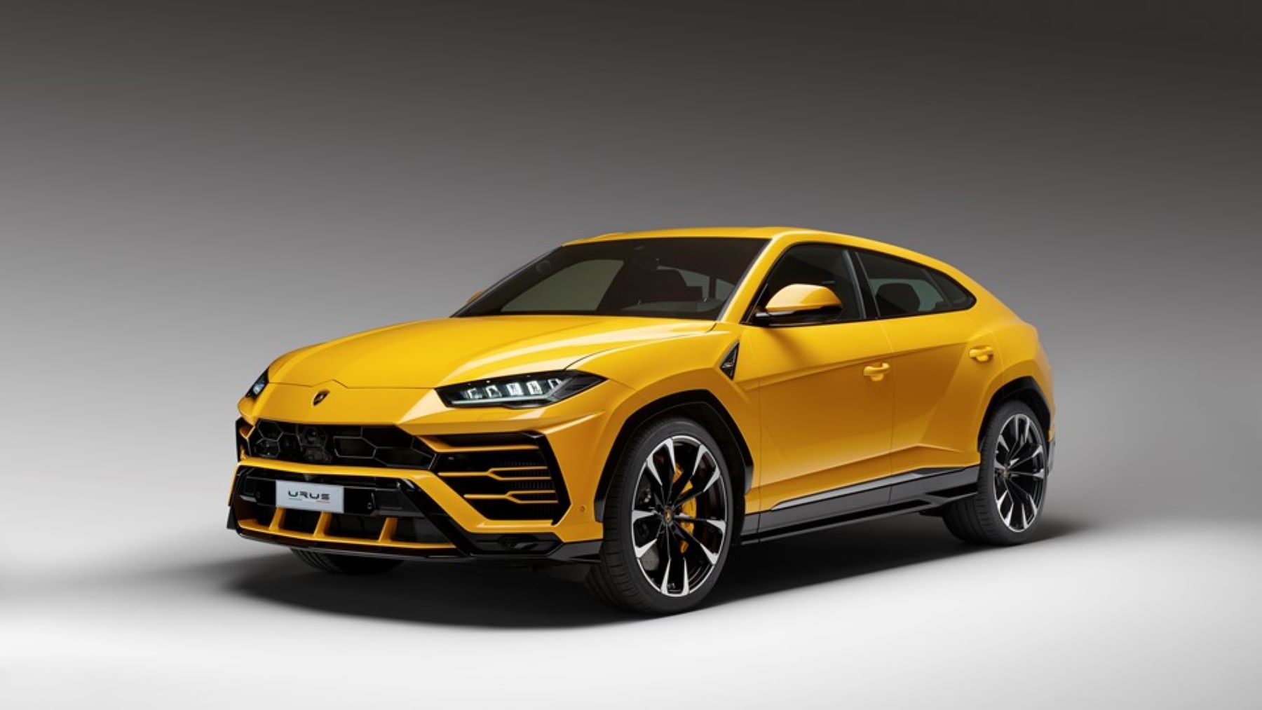 A rendering of a yellow Lamborghini Urus high-performance luxury SUV built through the company's online studio
