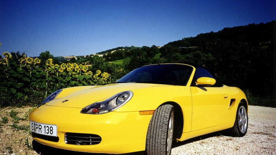 A yellow 986 Porsche Boxster