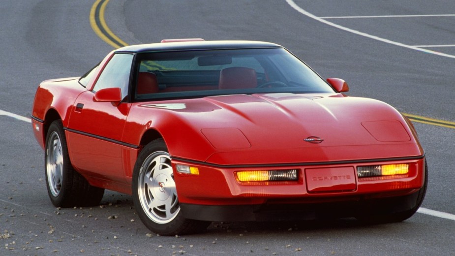 Red 1984 Chevy Corvette on a track