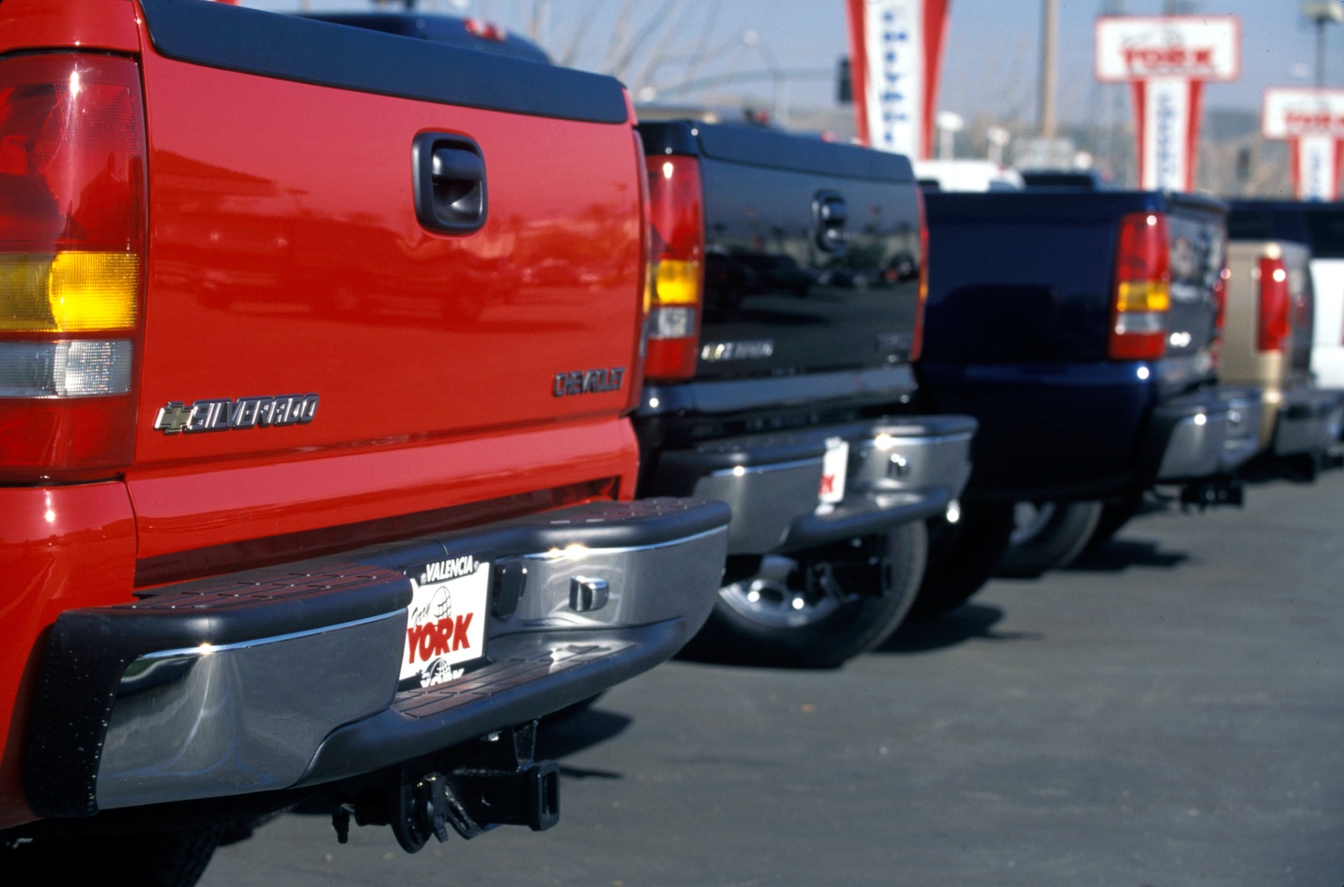 The back of some 2001 Chevy Silverado pickup trucks