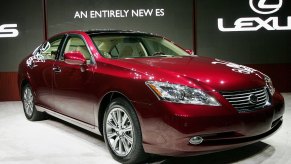 A Red 2007 Lexus ES350 luxury car on stage debuting at the Chicago auto show.