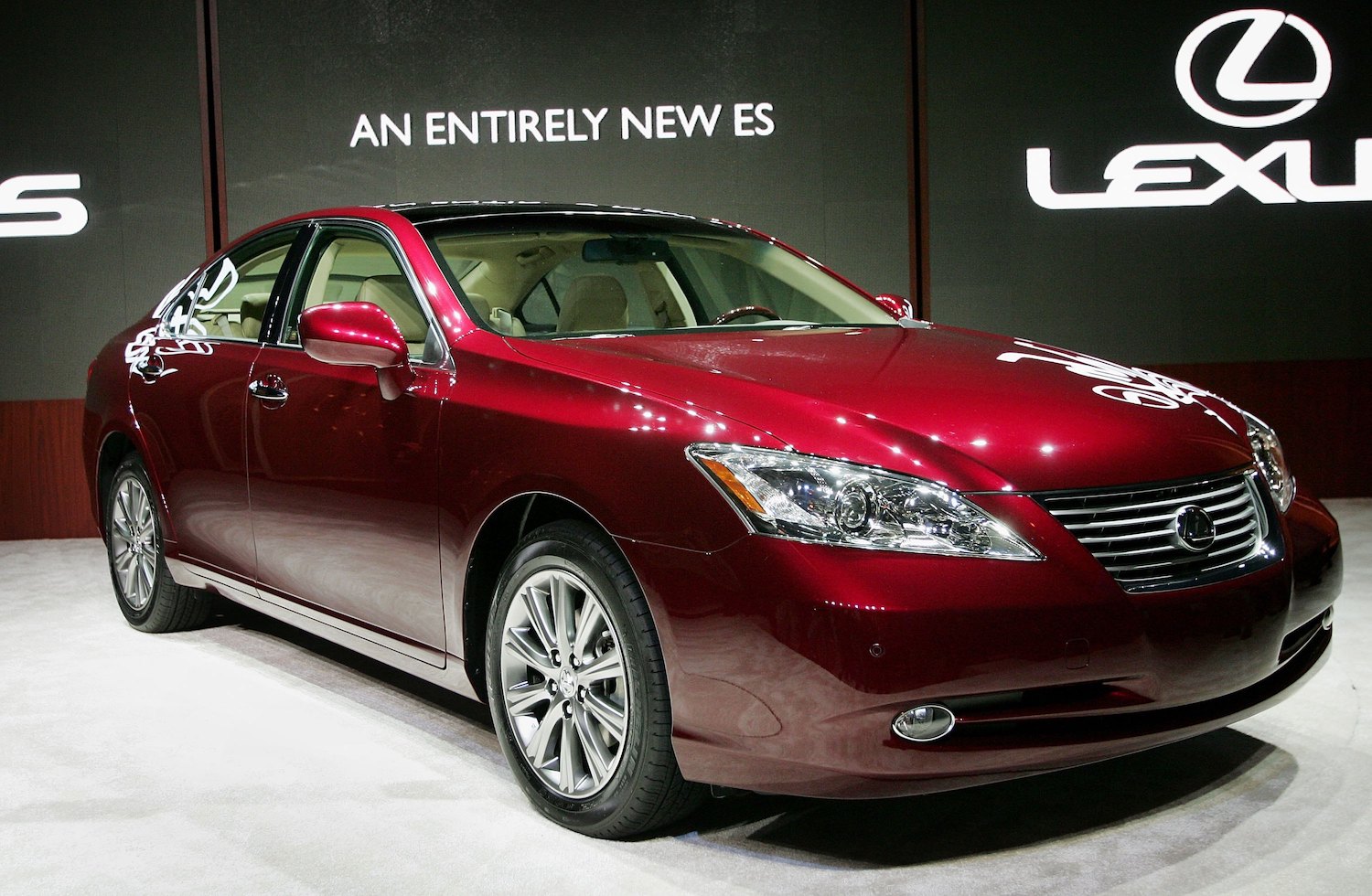 A Red 2007 Lexus ES350 luxury car on stage debuting at the Chicago auto show.