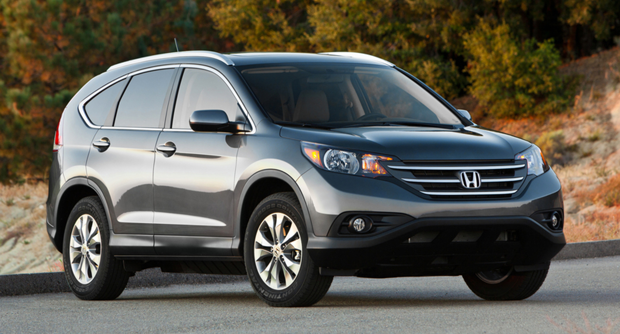A gray 2013 Honda CR-V small SUV is parked.