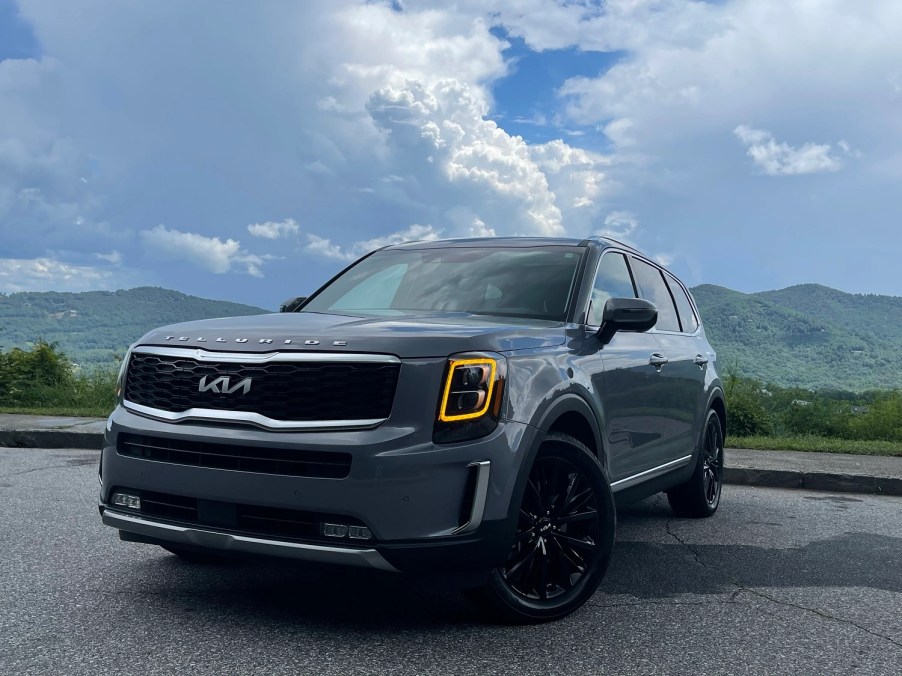 The 2022 Kia Telluride is shown facing the reader with the wheels turned to the left of the screen.