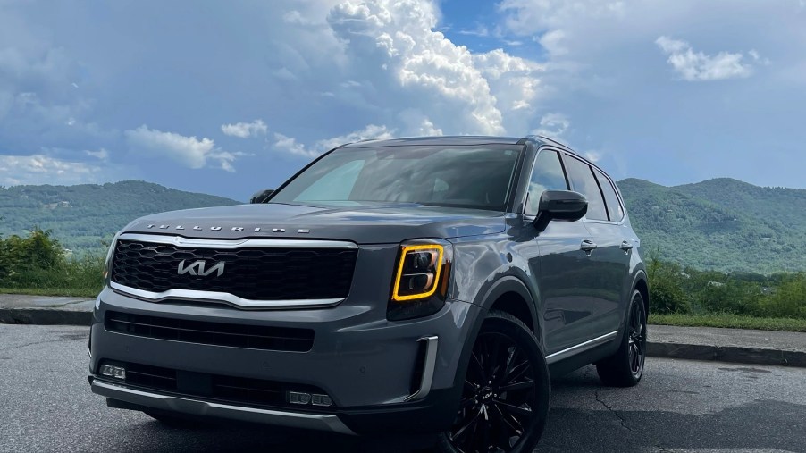 The 2022 Kia Telluride is shown facing the reader with the wheels turned to the left of the screen.