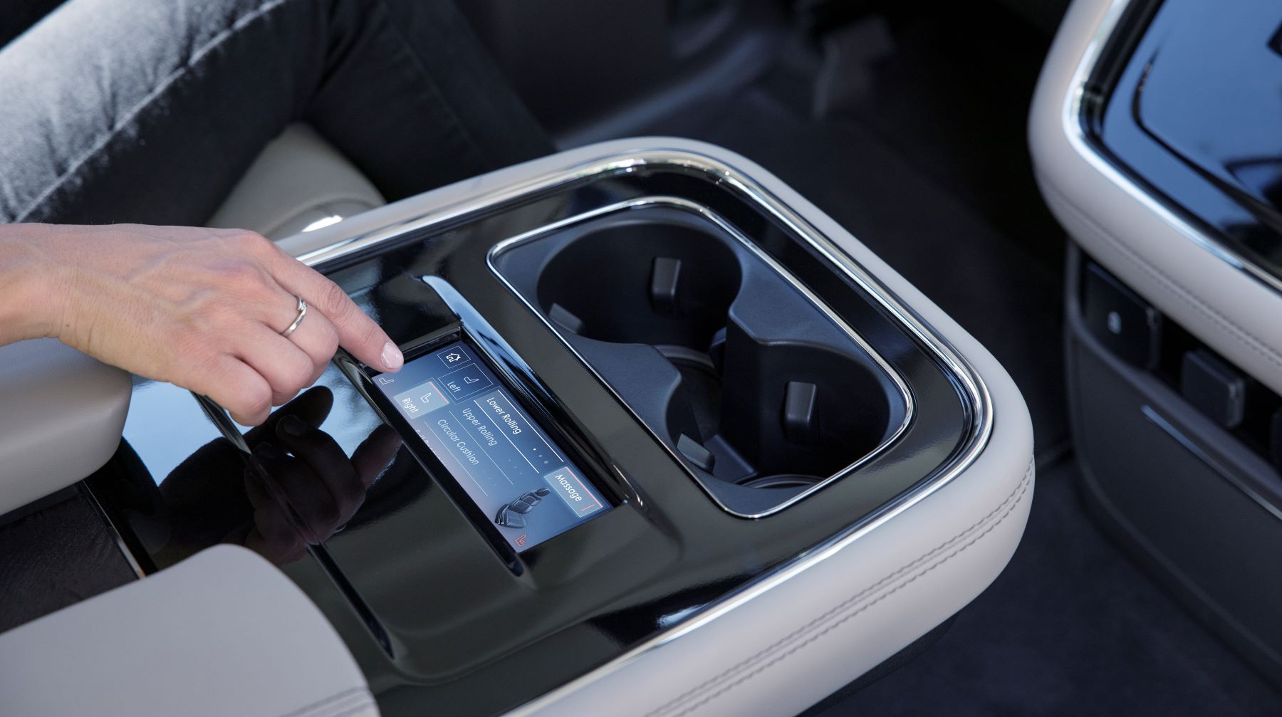A pair of cupholders found inside the 2022 Lincoln Navigator Flight Blue Reserve full-size luxury SUV model