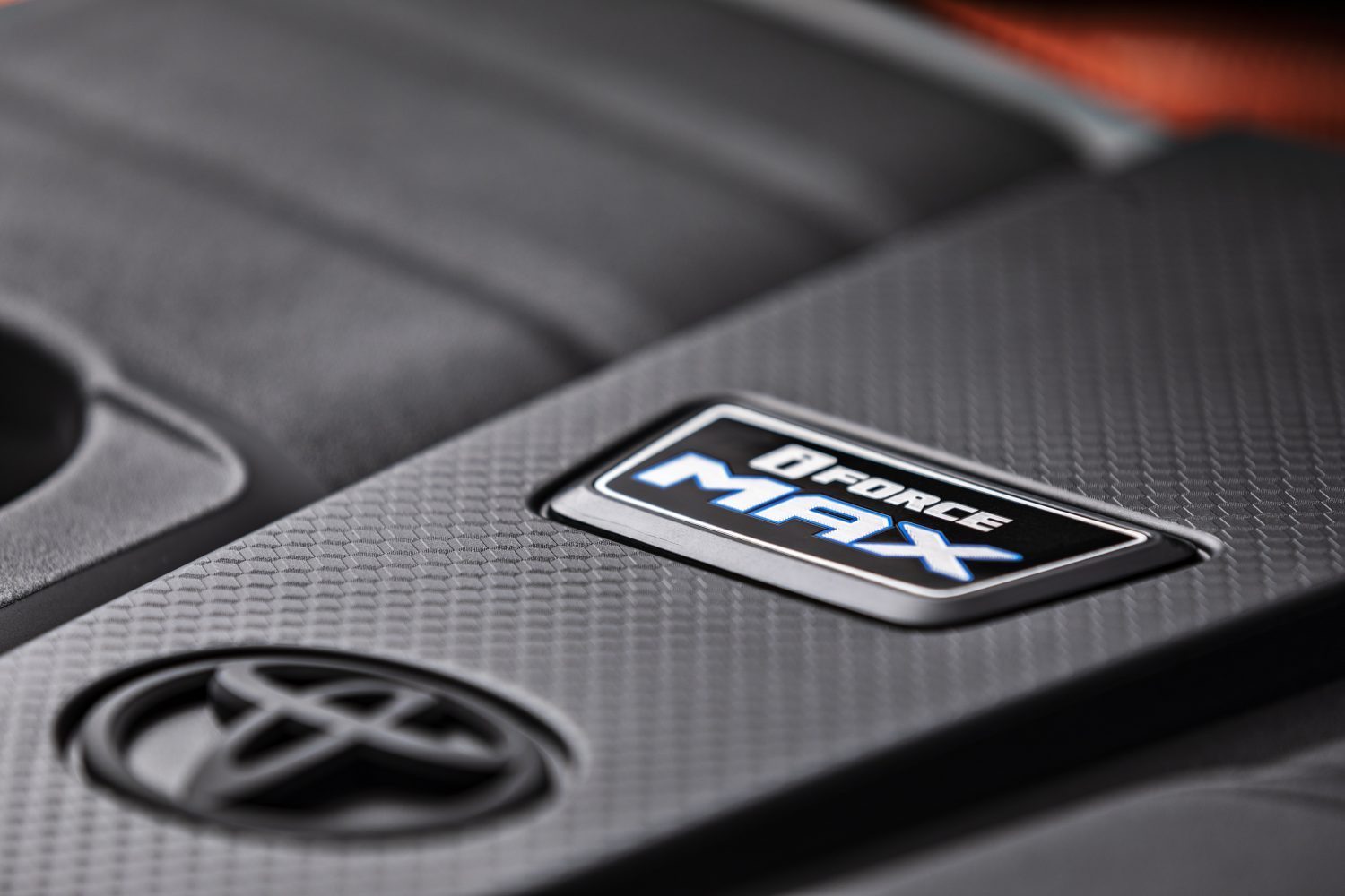 Detail photo of the engine cover of the Toyota Tundra i-FORCE MAX hybrid turbocharged V6 engine.