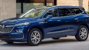 A blue 2023 Buick Enclave midsize luxury SUV model