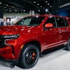 A red 2023 Chevrolet Tahoe parked indoors.