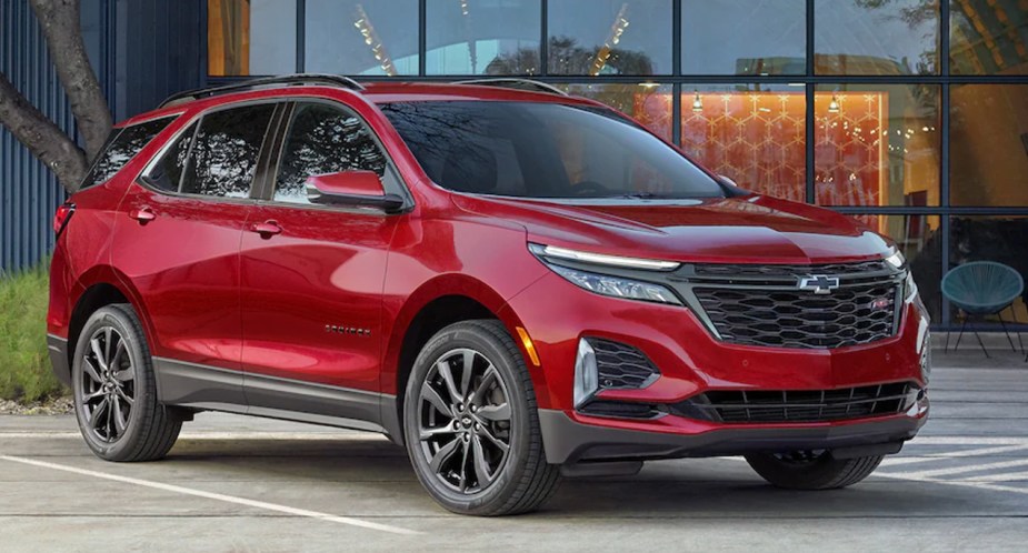 A red 2023 Chevrolet Equinox is parked. 