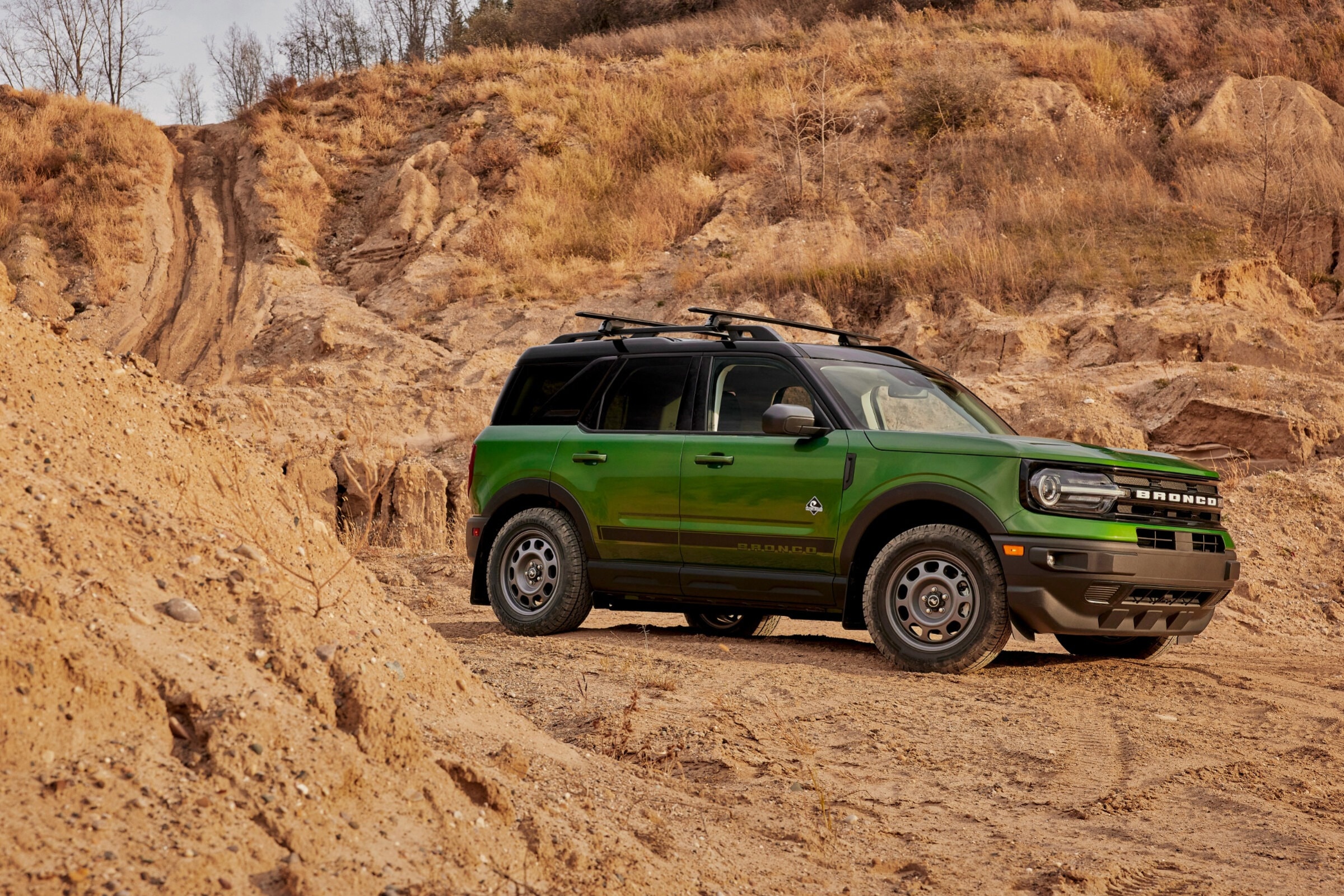 A green ford bronco sport with a black diamond package crossover off-road SUV.
