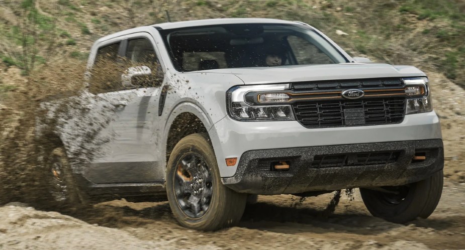 A gray 2023 Ford Maverick is driving off-road. 