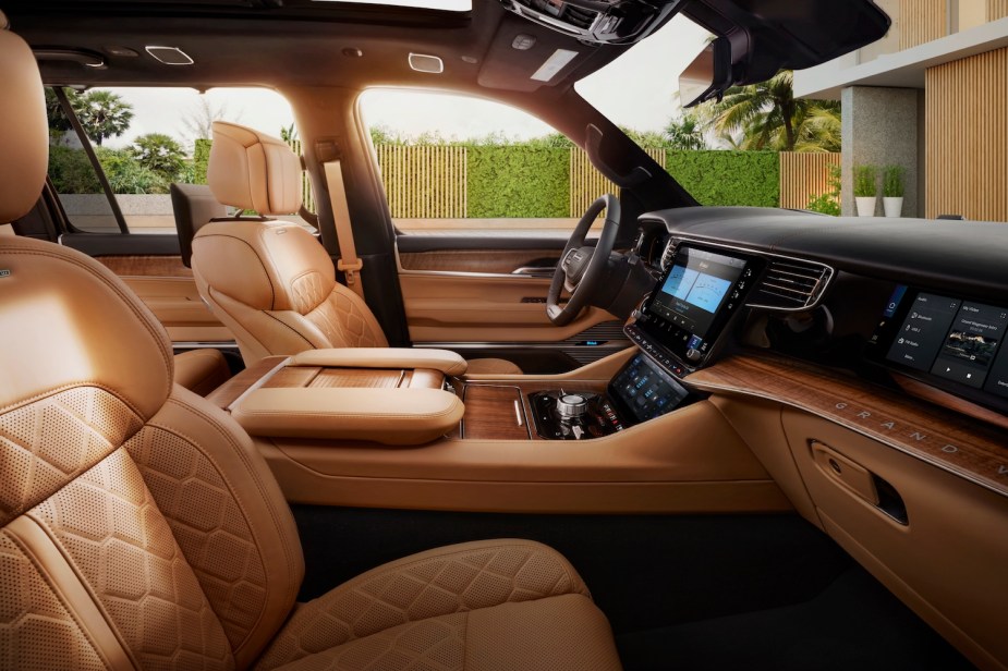 The quilted leather interior of a luxury Jeep Grand Wagoneer SUV.