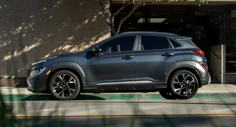 A black 2023 Hyundai Kona is parked on the road. 