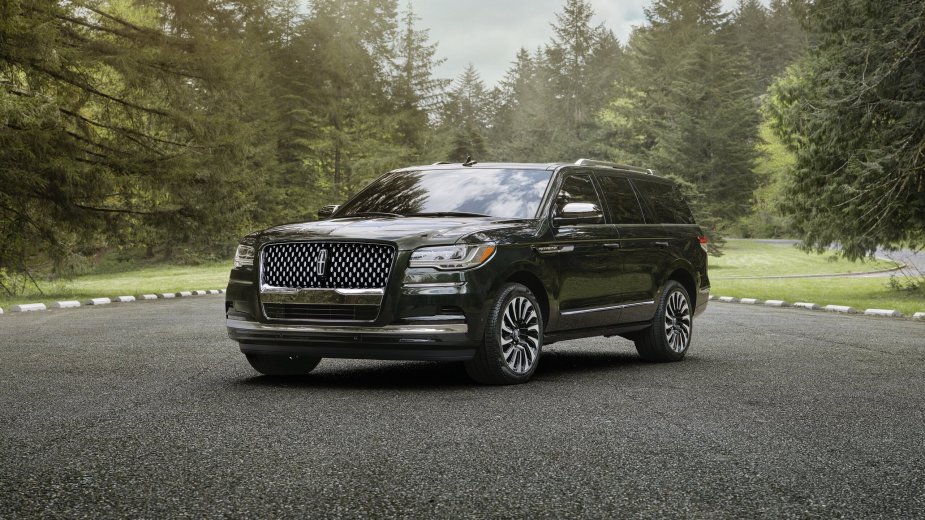 a 2023 Lincoln Navigator parked outside.  How much does it cost fully charged?