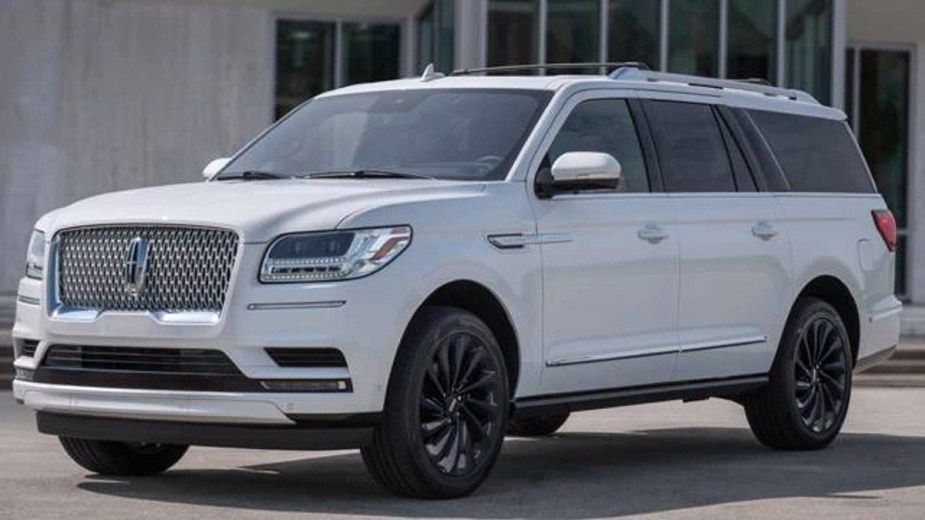 White 2023 Lincoln Navigator L in front of a house