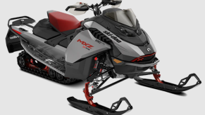 A red, black, and gray 2023 Ski-Doo MXZ snowmobile model