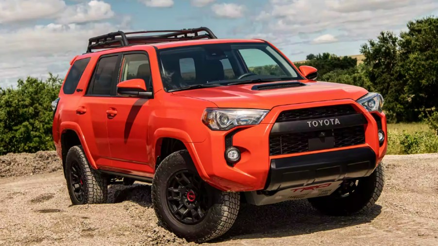 A red 2023 Toyota 4Runner midsize SUV is parked.