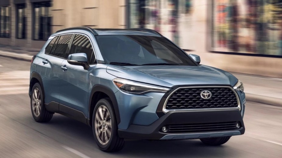 Blue 2023 Toyota Corolla Cross, Crossover is the most affordable 2022 Toyota SUV on city streets.