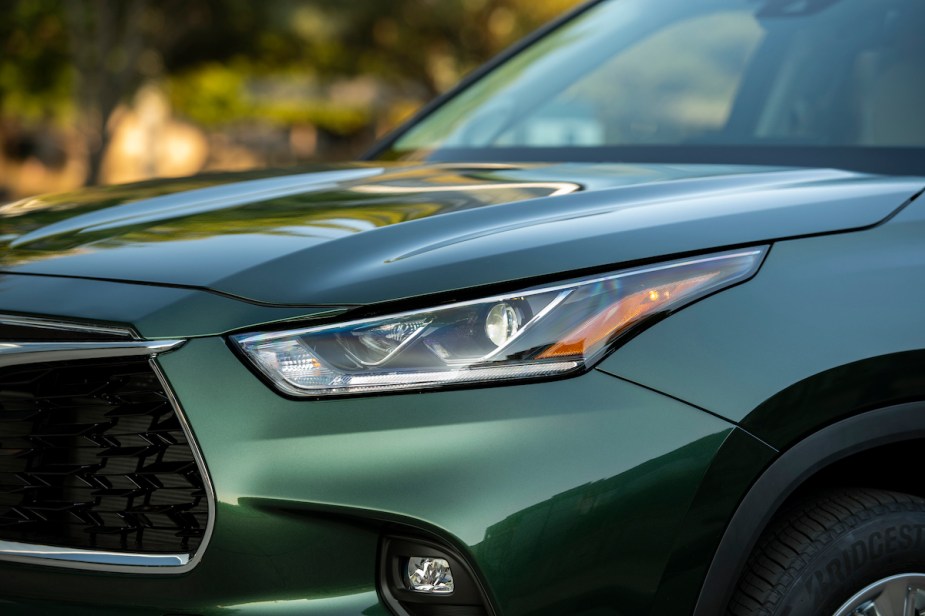A green 2023 Toyota Highlander headlight, one of Toyota's vehicles that has the curve-speed management system.