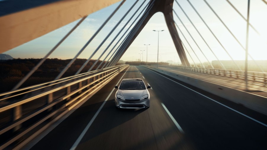 A 2023 Toyota Prius driving across a bridge
