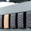 Audi black and tan seat upholstery cover options on display at a car dealership