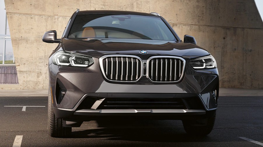 A gray 2023 BMW X3 small luxury SUV is parked.