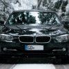 BMW on a snowy road, highlighting if cars with a black color are warmer in the winter