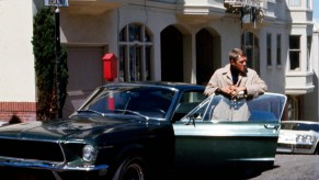 Steve McQueen hangs out with a Ford Mustang Bullitt GT390, which Bradley Cooper will have to top in the Bullitt remake.