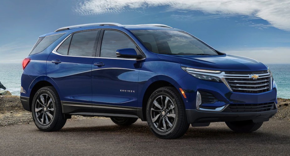 A blue 2023 Chevrolet Equinox small SUV is parked. 