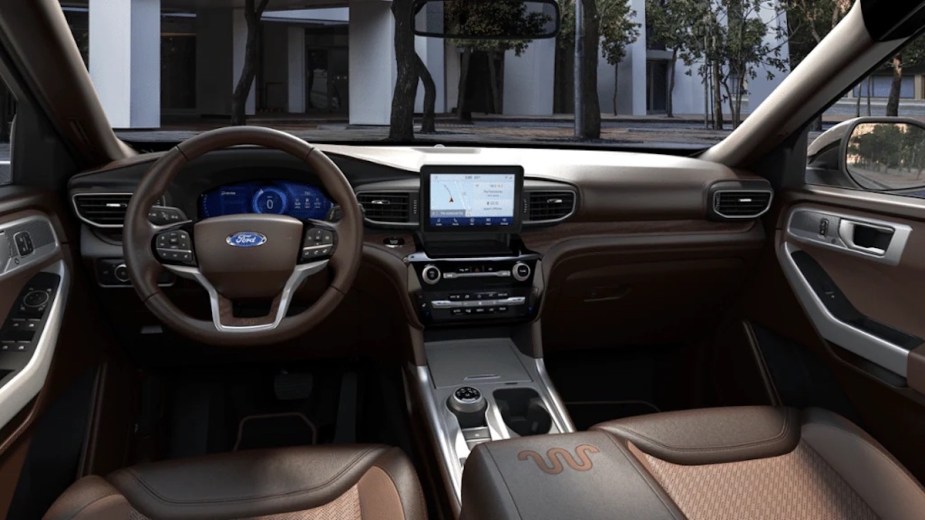 Dashboard and front seats in the new 2023 Ford Explorer King Ranch SUV, highlighting how much a fully loaded one costs