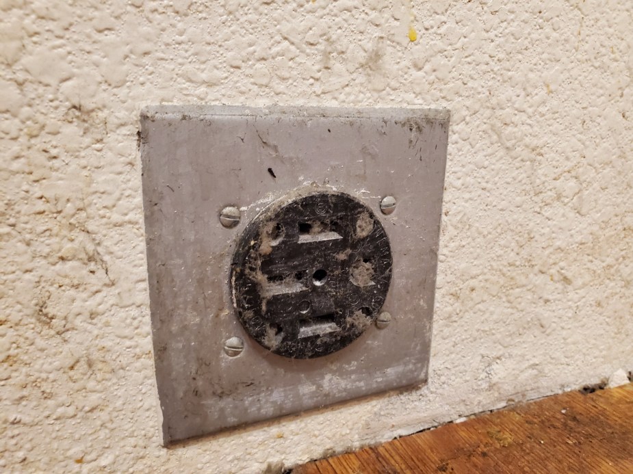 This dusty 240-volt power outlet used for a dryer or stove in an American home may be a budget-friendly way to charge your electric vehicle.