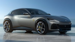 A gray 2023 Ferrari Purosangue luxury sports SUV is parked.