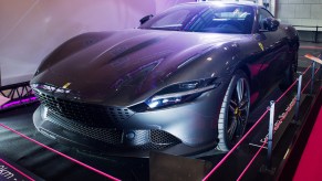A Ferrari high performance car parked indoors.