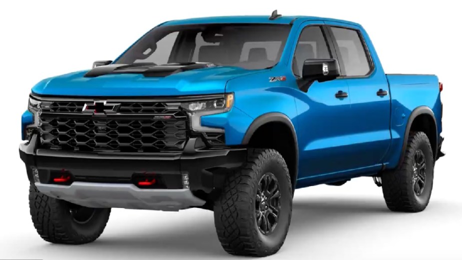 Front angle view of new 2023 Chevy Silverado pickup truck with Glacier Blue Metallic exterior paint color