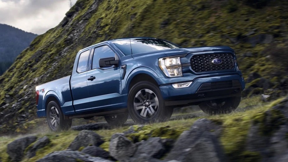 Front angle view of blue 2023 Ford F-150 pickup truck, the most popular car for rich Americans