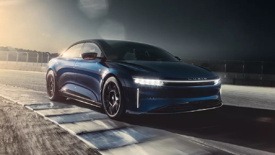 Front angle view of blue 2023 Lucid Air, which has a higher driving range than all Tesla models