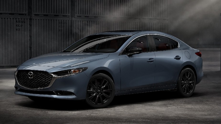 Front angle view of light blue 2023 Mazda3 compact car
