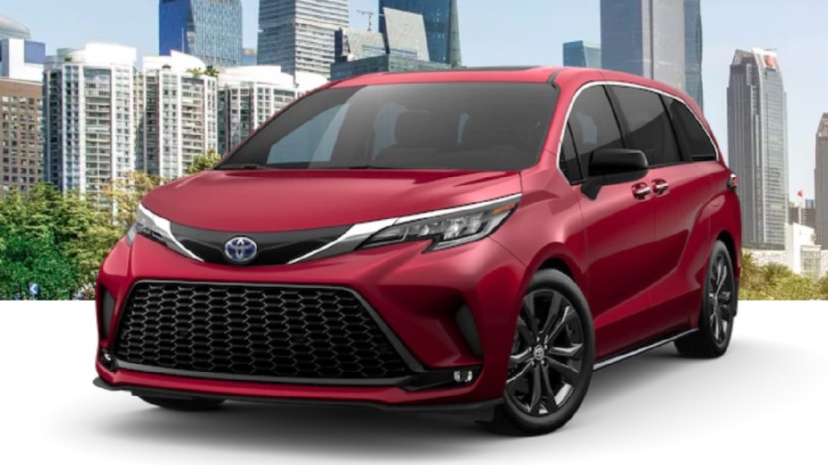 Front angle view of new 2023 Toyota Sienna minivan with Ruby Flare Pearl exterior paint color