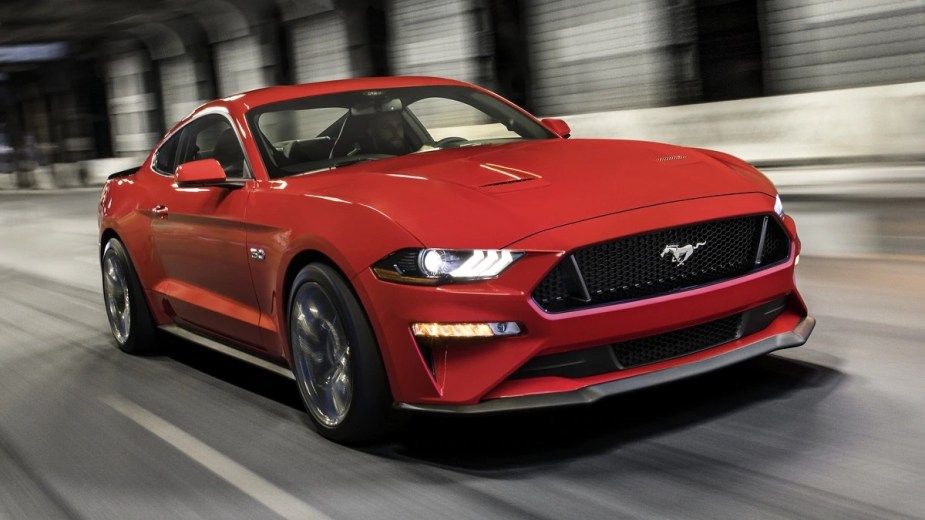 Front angle view of orange-red 2023 Ford Mustang