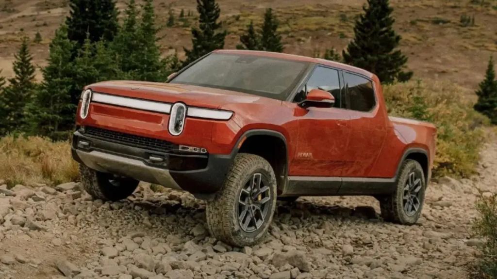 Red 2023 Rivian R1T pickup front 3/4 view