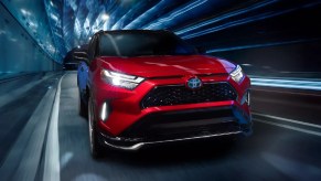 Front angle view of new red 2023 Toyota RAV4 Prime XSE, highlighting how much a fully loaded one costs
