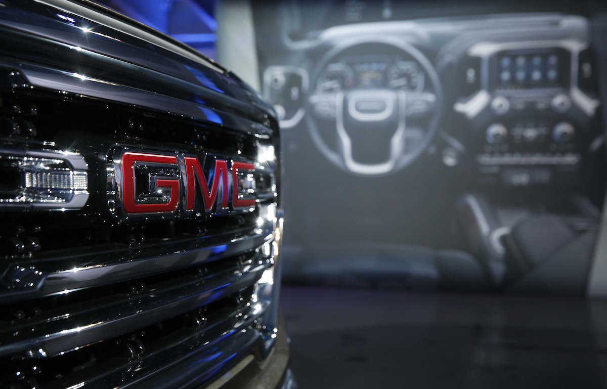 GMC logo on a Sierra, which ties as the best mpg truck.
