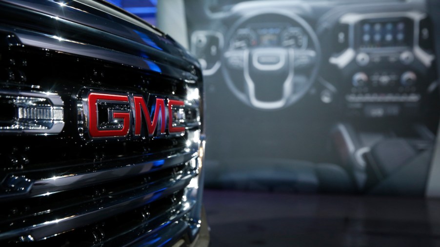 GMC logo on a Sierra, which ties as the best mpg truck.