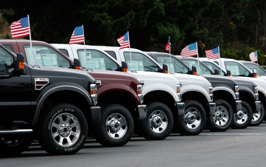 A row of Ford F-150 pickup truck parked at a car dealership that may struggle with EV sales.